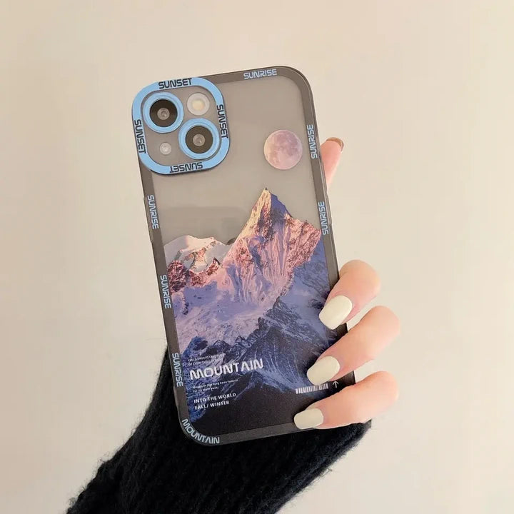 Snow covered mountains iPhone case blue in hand 