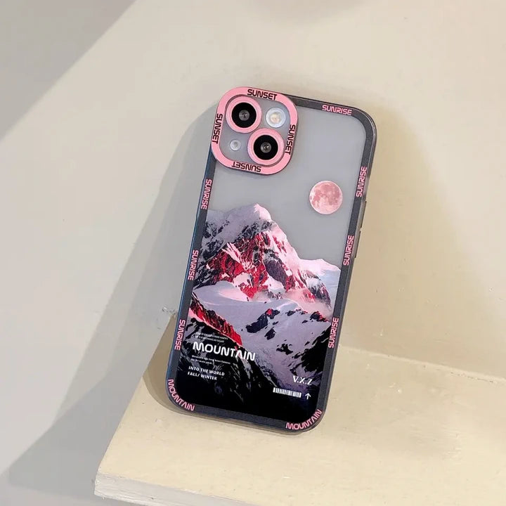 Snow covered mountains iPhone case pink phone on the shelf