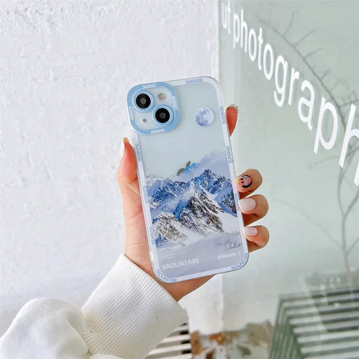 Snow covered mountains iPhone case white in hand photograph